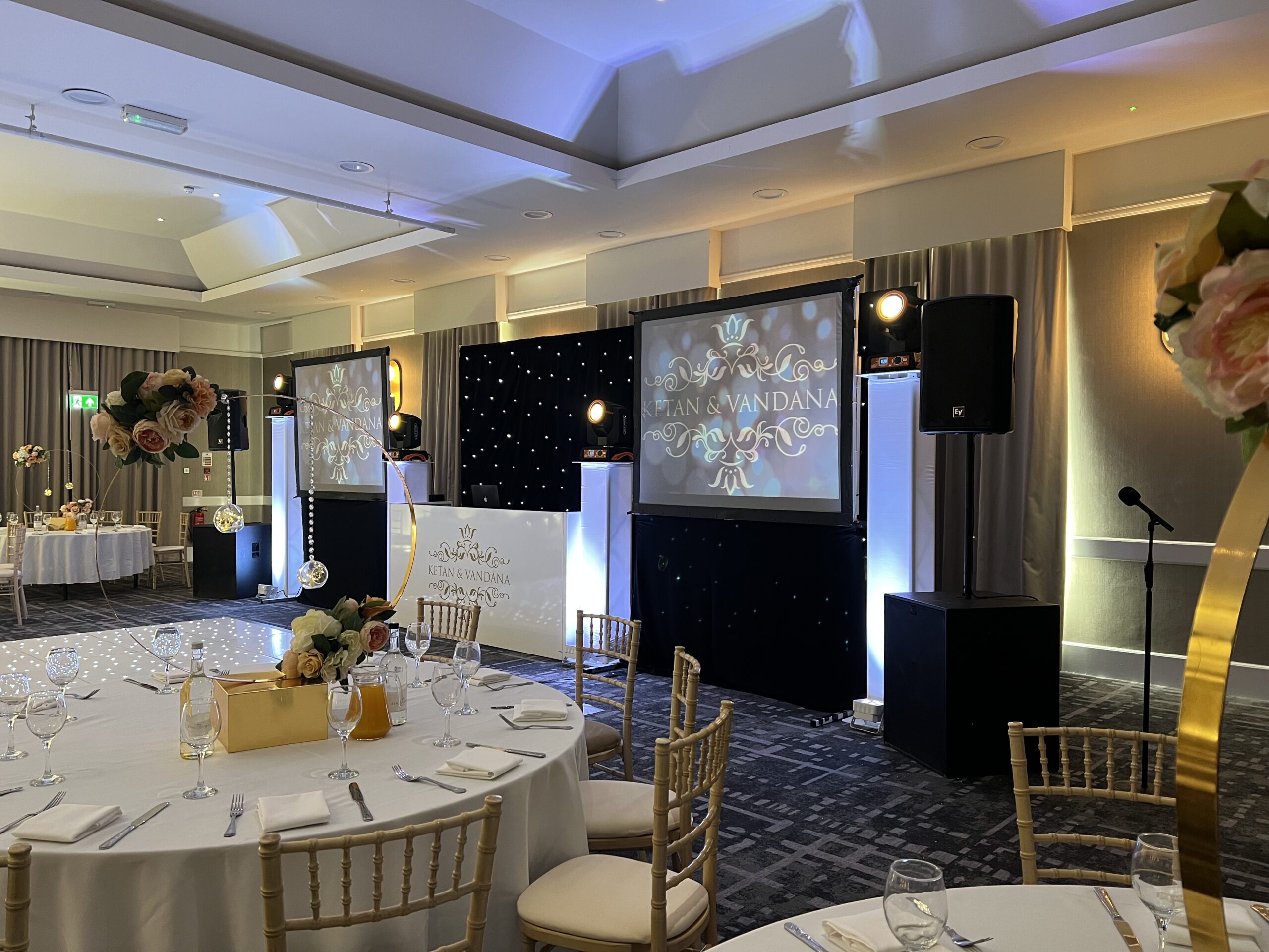 Asian wedding DJ package with projector screen, LED starcloth and lighting setup with dance floor by AK Musik