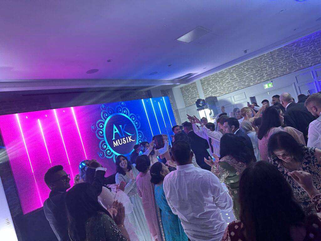 Indian Punjabi Asin wedding DJ London with LED dancefloor lighting and packed dancefloor by AK Musik
