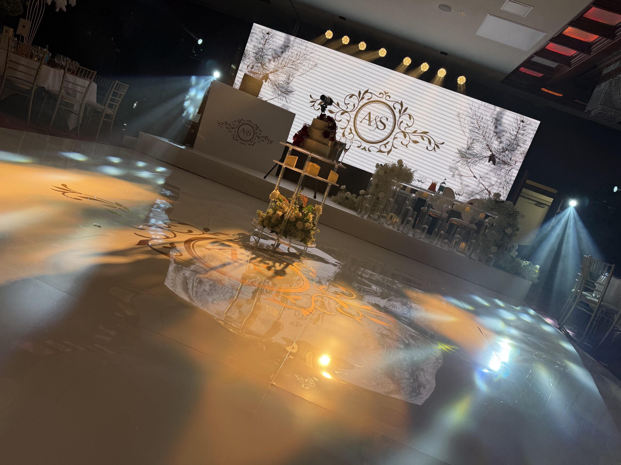 Luxury wedding seamless dancefloor with stage set LED wall and bespoke lighting by AK Musik