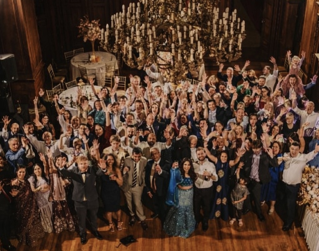 Packed wedding dancefloor celebration with luxury lighting and DJ performance - AK Musik