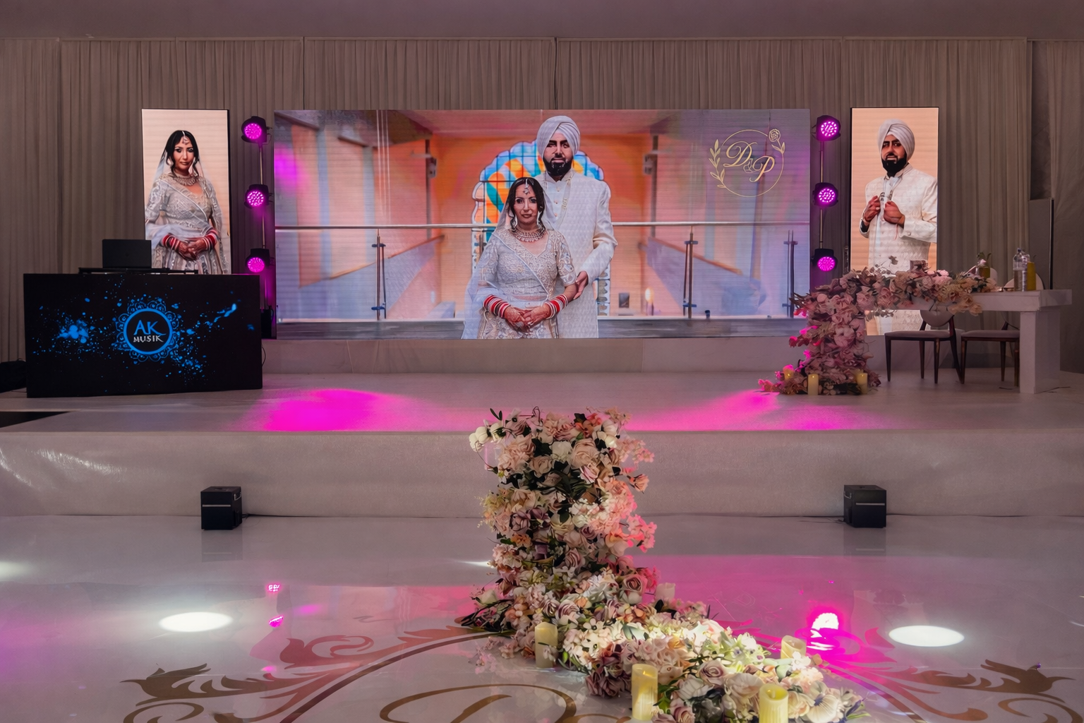 Split LED DJ booth with panoramic wedding LED wall and moving head wash lighting at a luxury Asian wedding reception by AK Musik