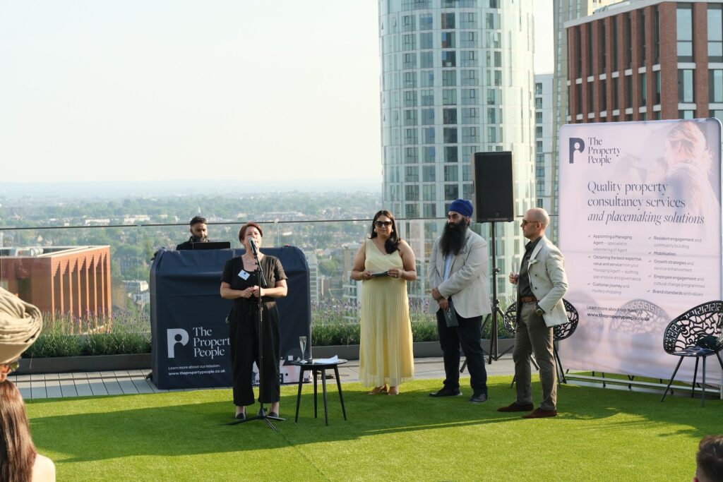 Corporate event presentation with speakers, wireless microphones and DJ setup overlooking London skyline